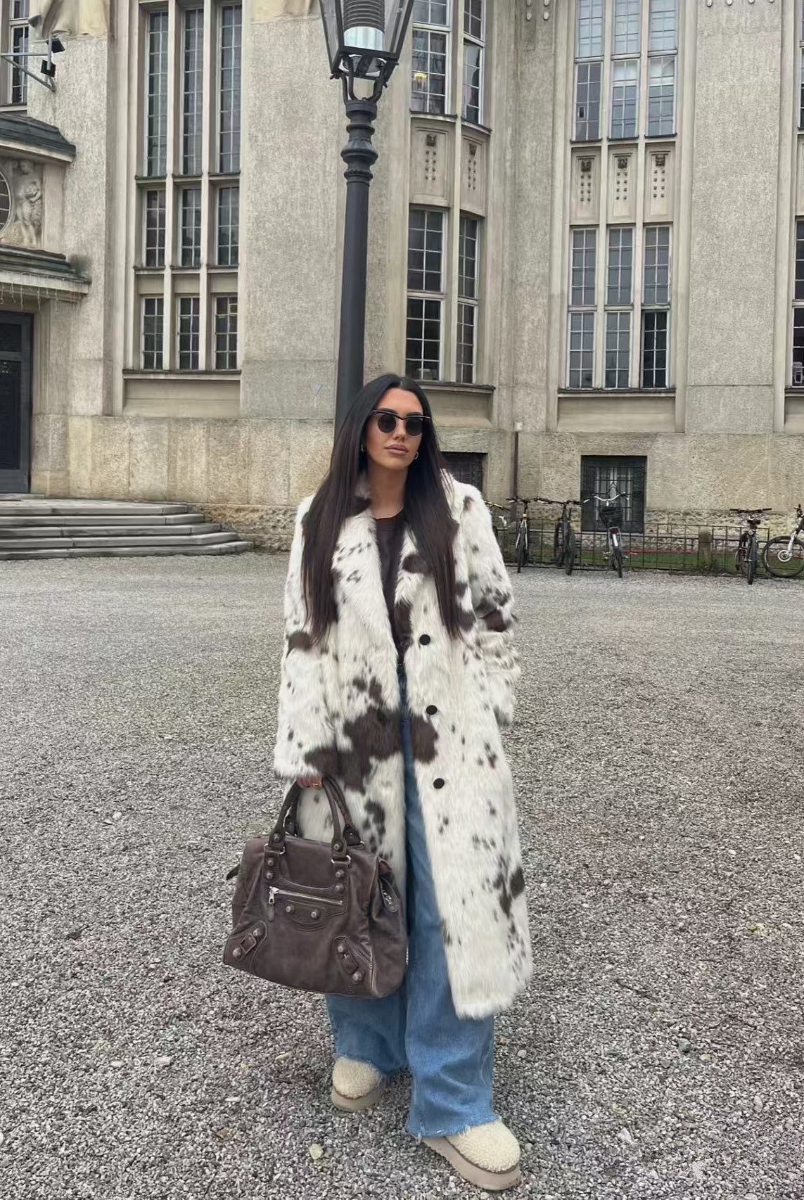 Cozy faux fur long coat in cow print with brown and white spots