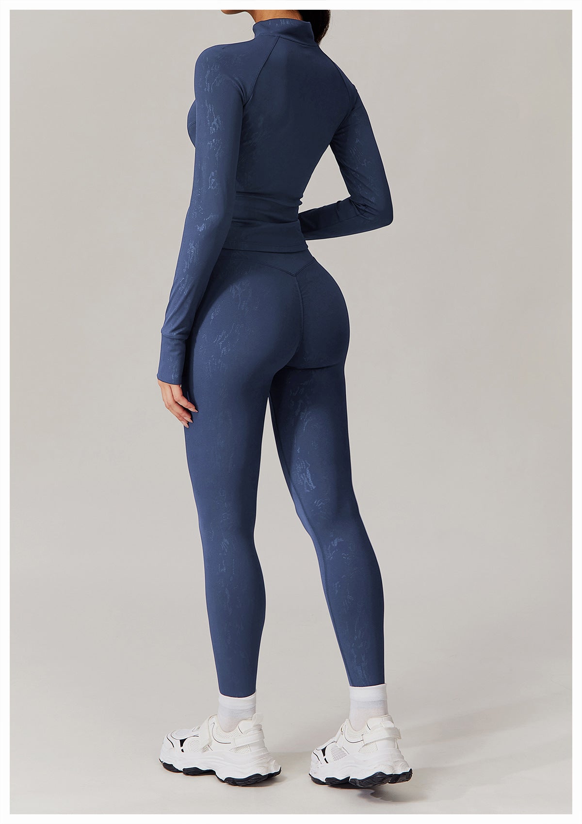 Women’s dark blue long-sleeved athletic top and matching leggings for yoga wear fashion