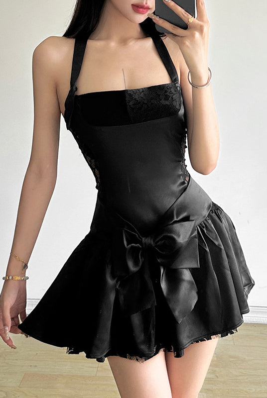 Black halter-neck mini dress with bow detail, perfect for fashionable occasions and ملابس