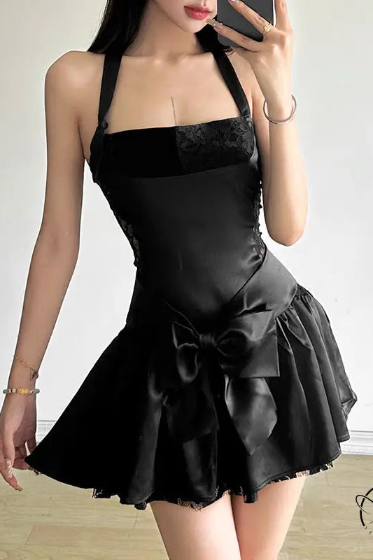 Attractive bow halter slim dress in black with bow detail and flared skirt