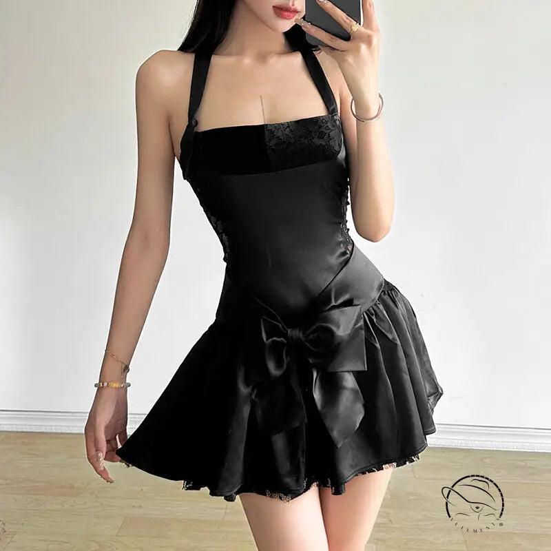 Attractive bow halter slim dress in black with bow detail and flared skirt