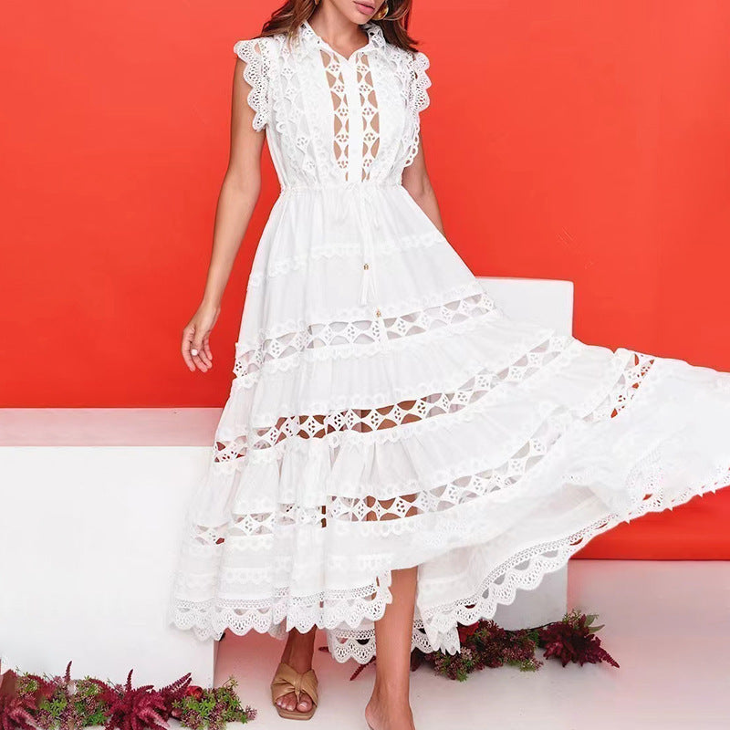 White lace-trimmed tiered dress with stand collar, perfect for elegant spring fashion