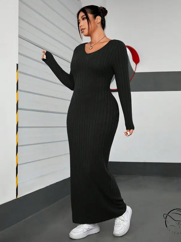 Black ribbed knit maxi dress in winter minimalist slim fit sheath style