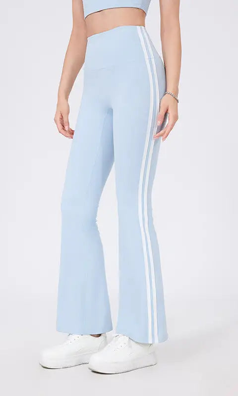 Light blue high waist yoga pants with white stripes and peach hip raise design
