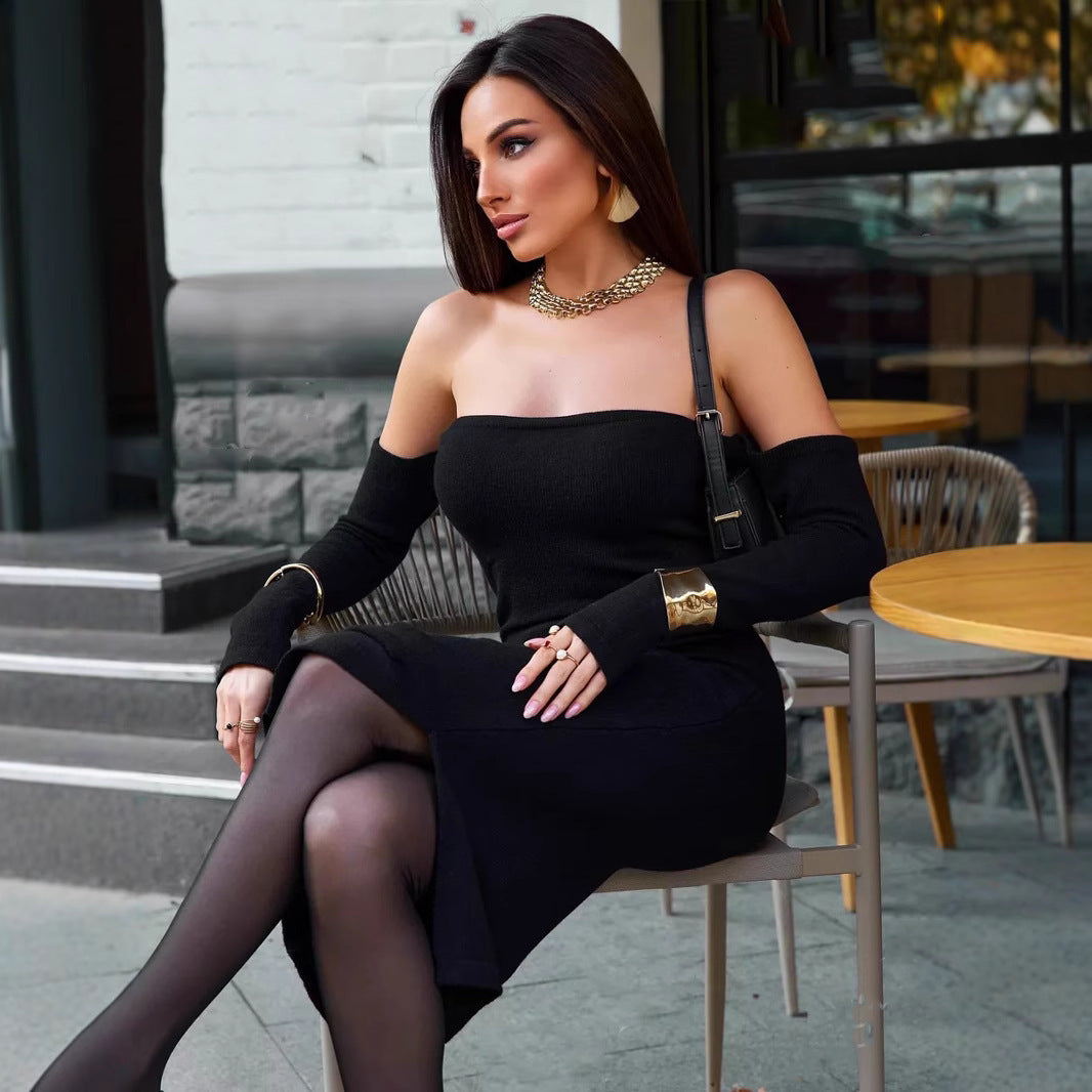 Woman in black strapless knitted dress showcasing elegant fashion and stylish ملابس