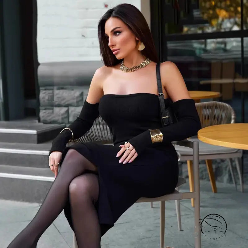 Elegant woman in langry black off-shoulder knitted fashion dress