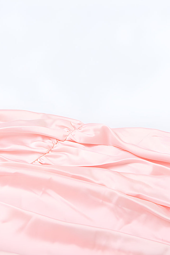 Pink ruched fabric with soft pleats on a fashionable tube top backless dress for women