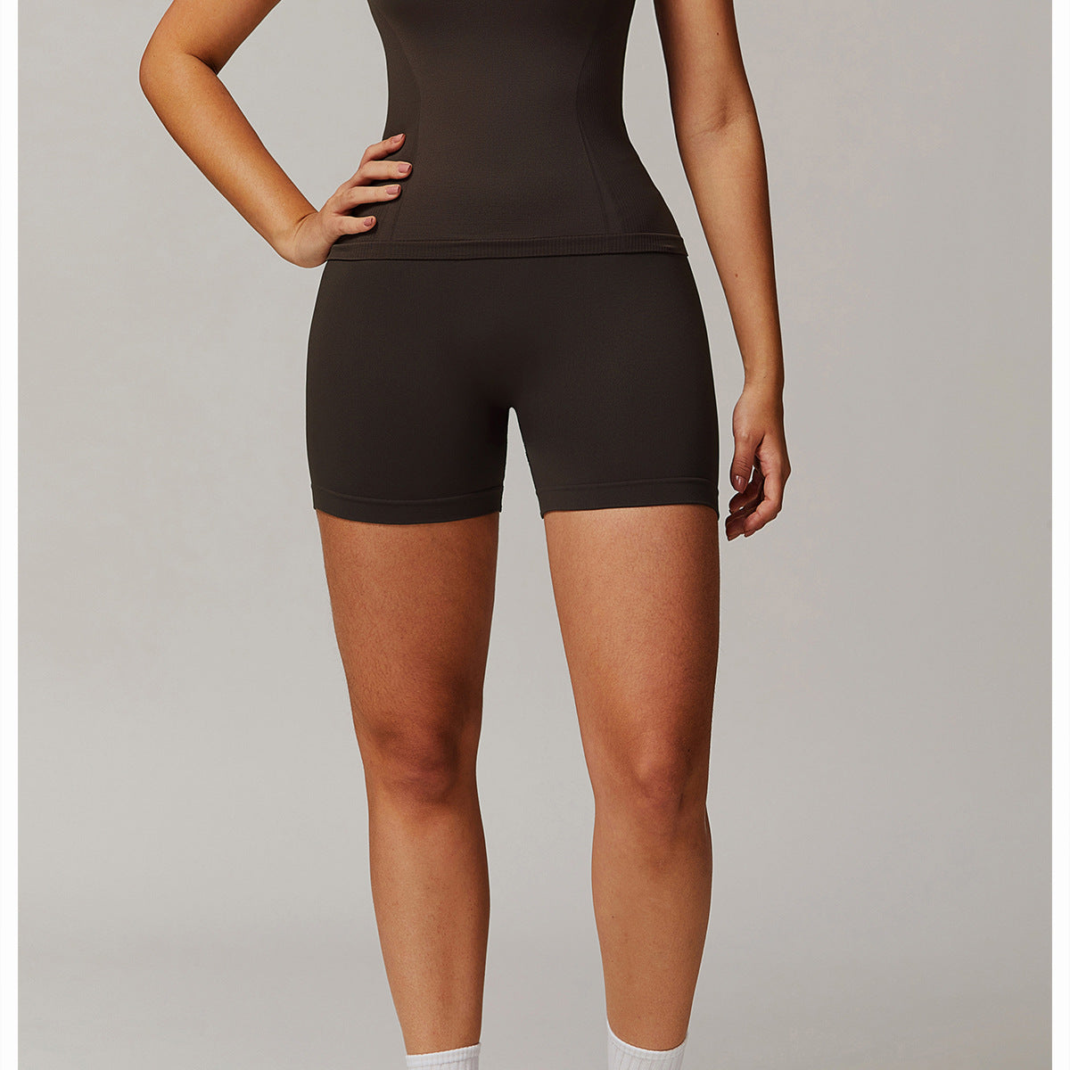 Dark athletic top and shorts set from Thread Seamless, perfect for yoga fashion ملابس