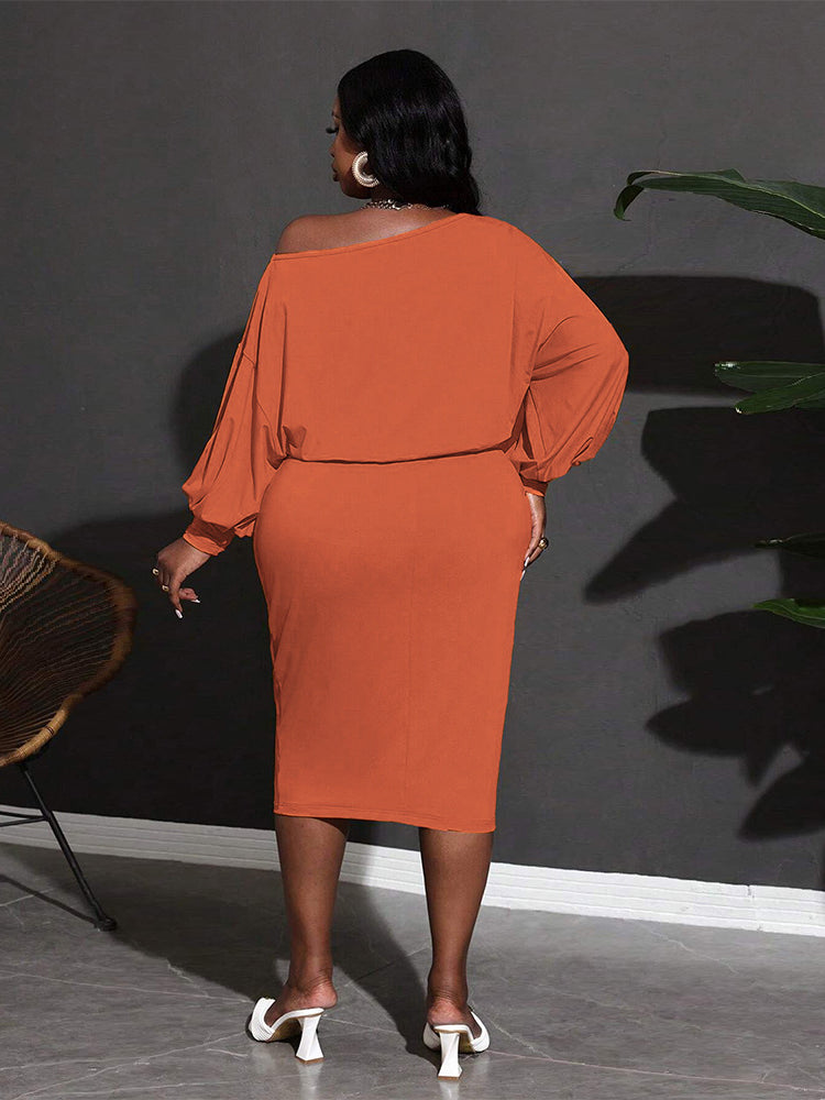 Woman in an orange off-the-shoulder dress from Classic Mid Length Dress fashion collection