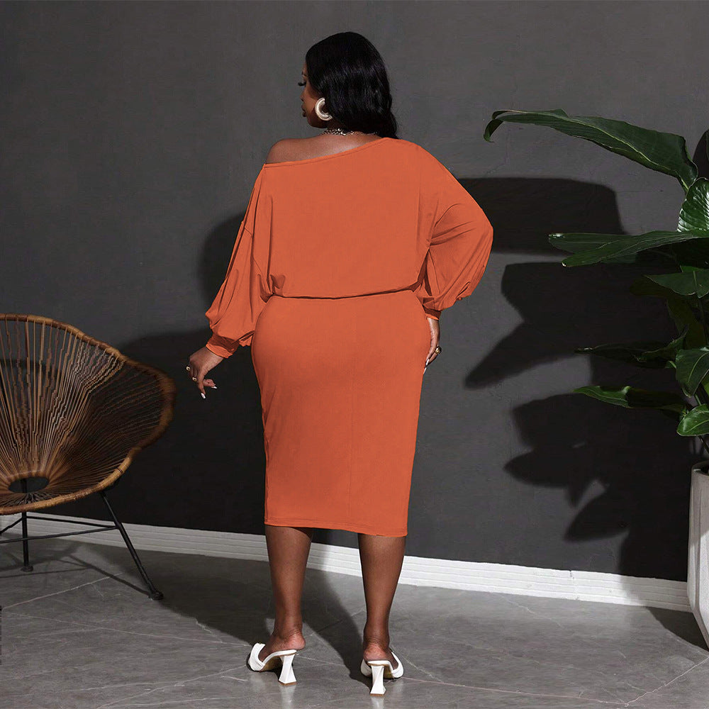 Woman in an orange off-the-shoulder dress from Classic Mid Length Dress fashion collection
