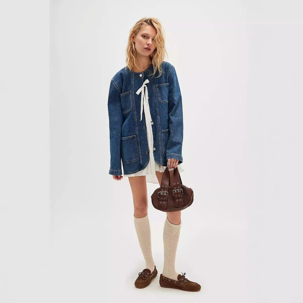 Casual fashionable cowboy coat featuring a light-wash denim jacket with front ties
