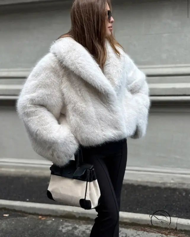 Cozy short faux fur coat in white fluffy style with black trim