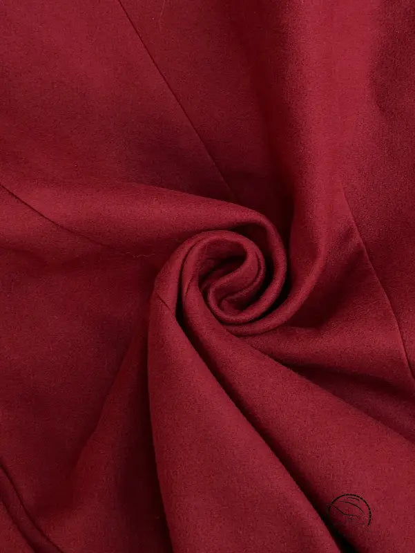 Elegant red silk fabric with sheen in double breasted long coat
