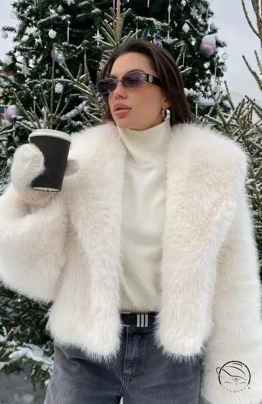 Gorgeous faux fur jacket with black belt and sunglasses