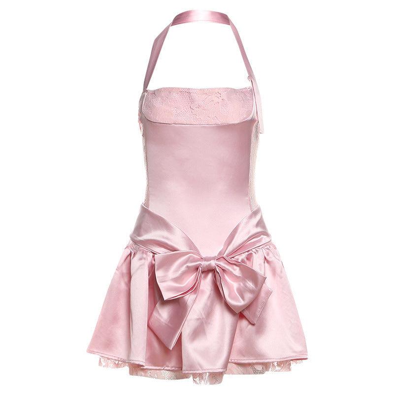Pink satin halter dress with bow at waist, perfect for fashion lovers seeking ملابس elegance