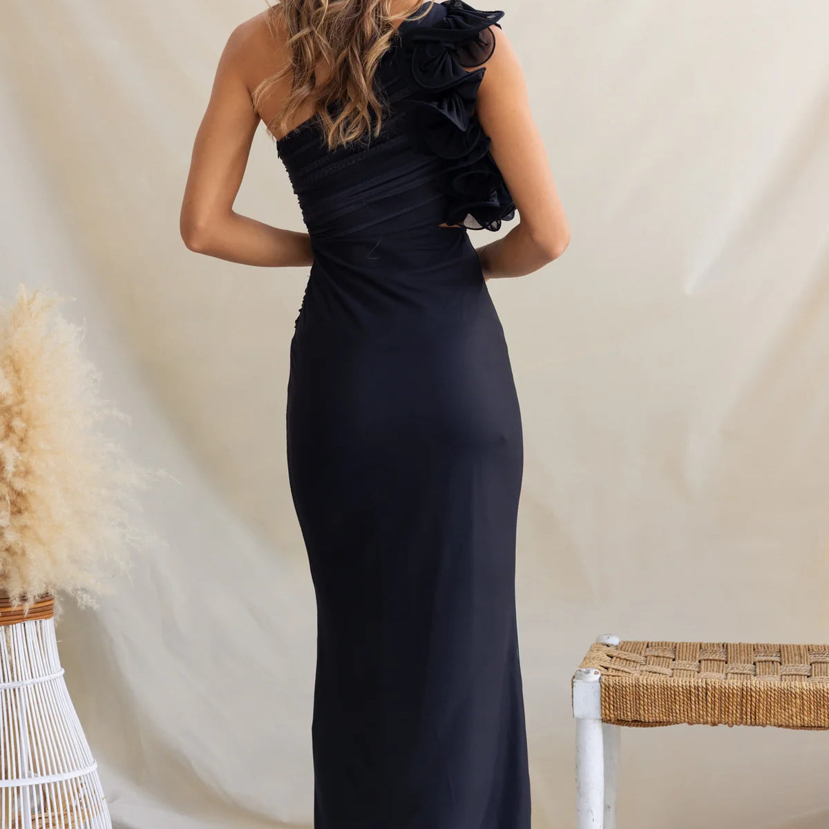 Black one-shoulder maxi dress showcasing elegant langry fashion and stylish ملابس