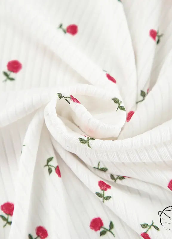 White ribbed langry cardigan with red rose embroidery and green stems