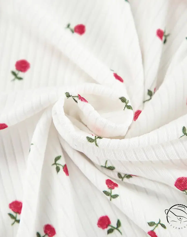 White ribbed langry cardigan with red rose embroidery and green stems