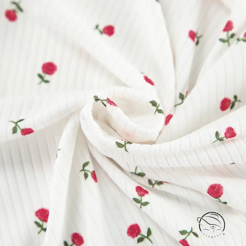 White ribbed langry cardigan with red rose embroidery and green stems