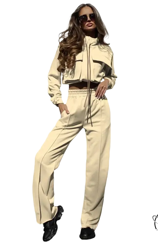 Woman in elegant vetements suit with long sleeve beige tracksuit