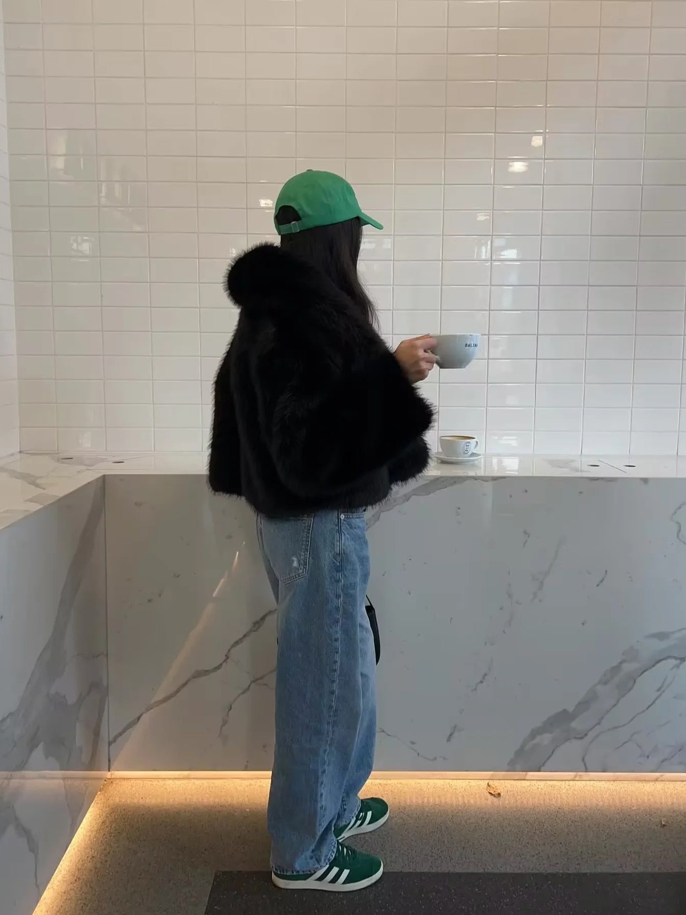 Green adidas sneakers with faux fur accents in langry fashion