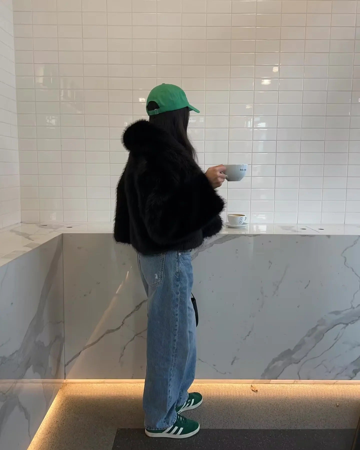 Green adidas sneakers with faux fur accents in langry fashion