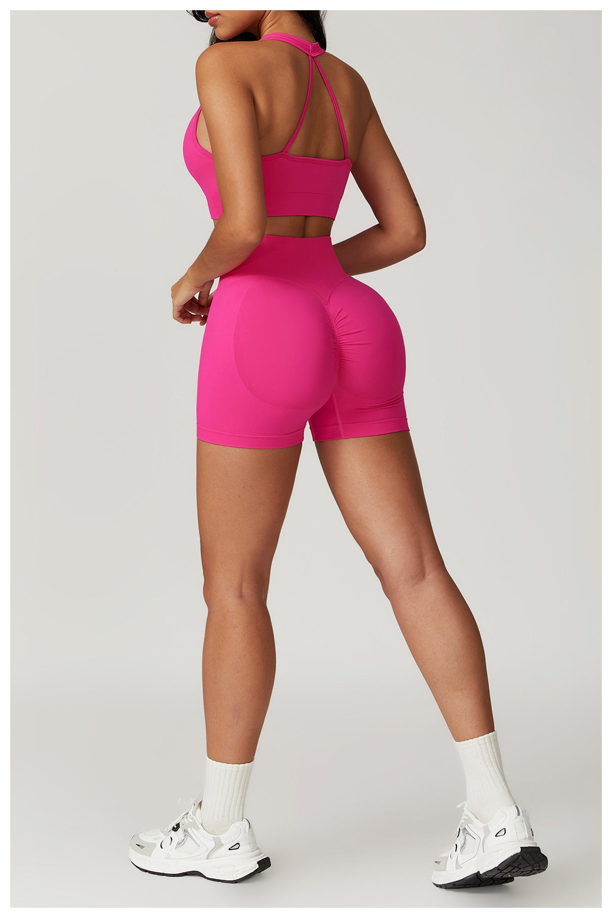 Pink athletic set featuring Seamless Yoga Suit with bra shorts for optimal comfort
