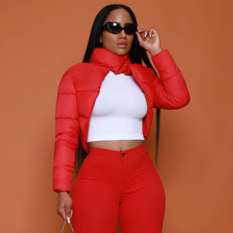 Woman in red winter half turtleneck slim fit cotton padded coat and pants