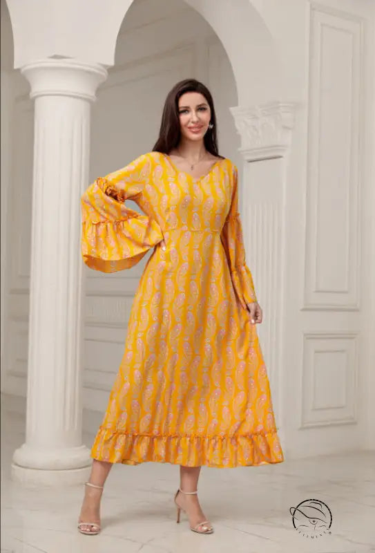 Vibrant yellow langry fashion midi dress with bell sleeves and paisley patterns