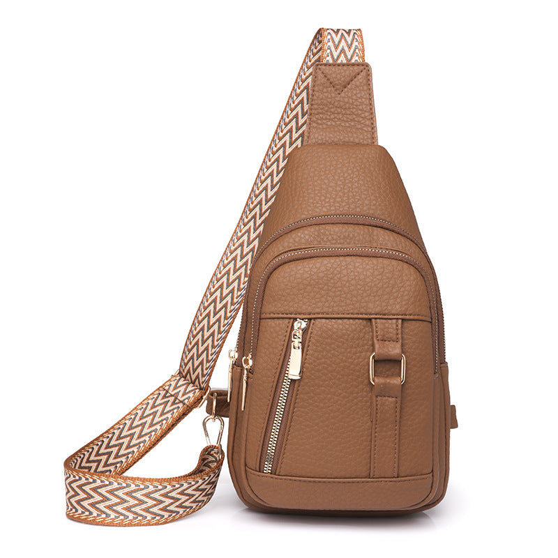 Brown faux leather sling bag with patterned strap for trendy fashion and ملابس style