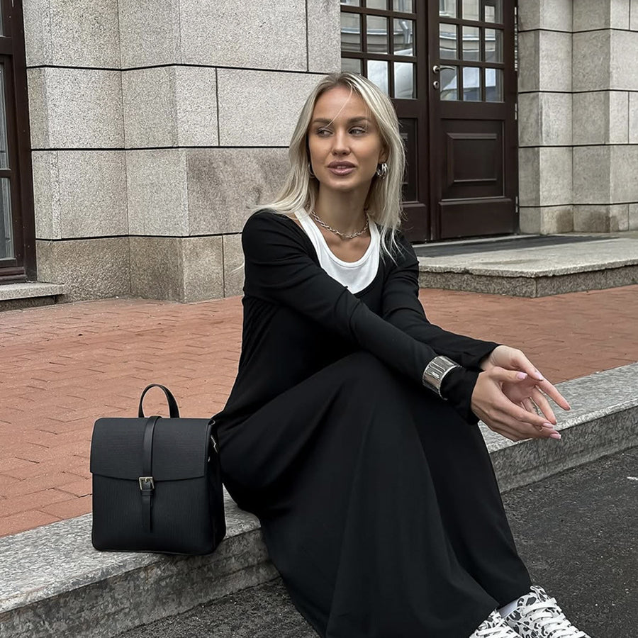 Black knit maxi dress with white sneakers and a black backpack for stylish fashion ملابس