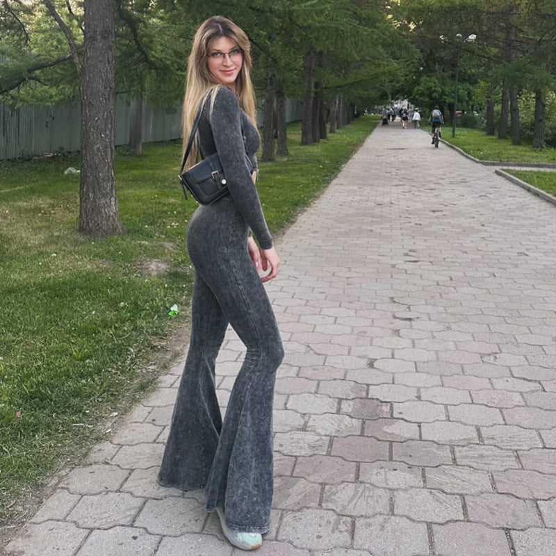 Woman wearing dark gray patterned slim casual trousers with high waist and bell bottom style, fashionable ملابس