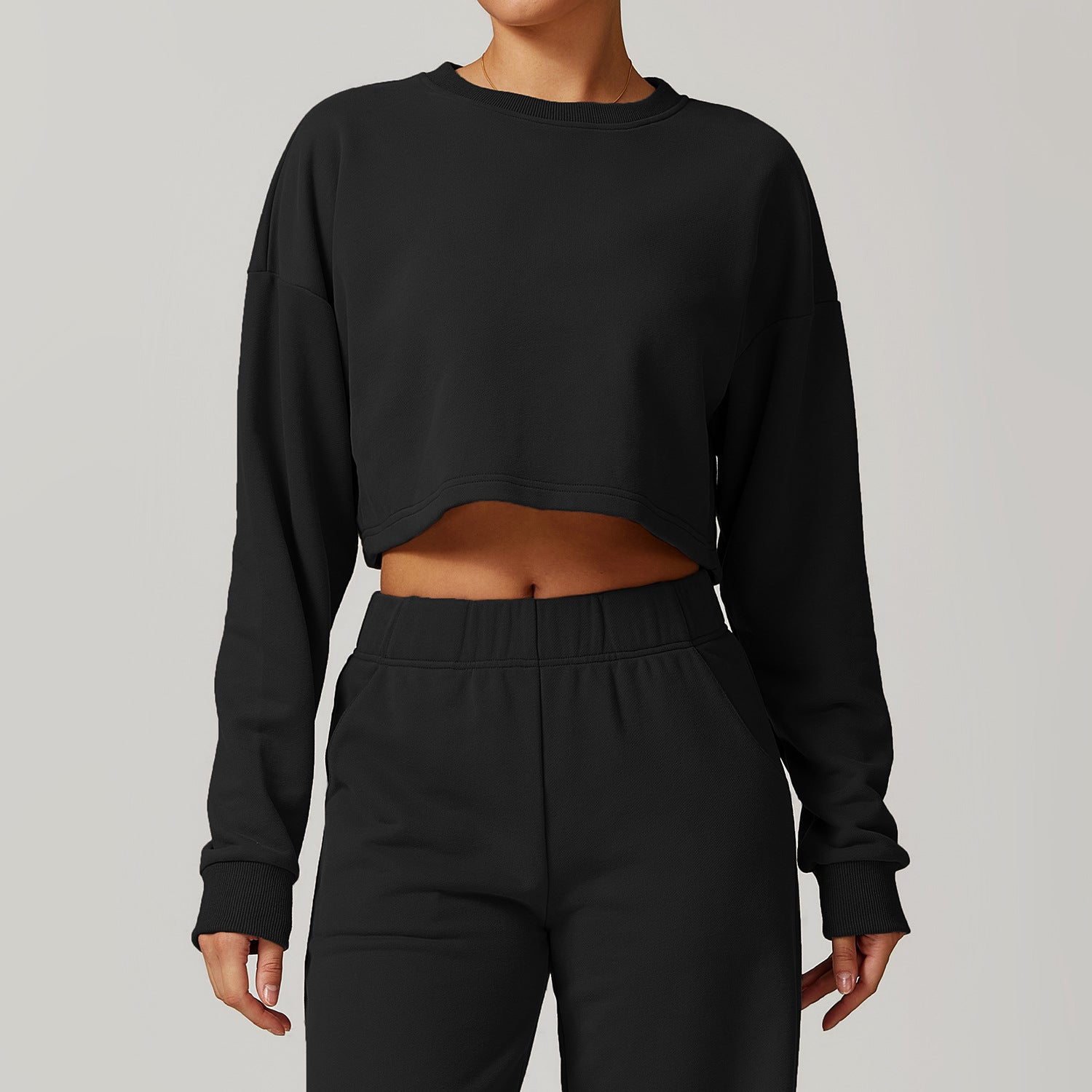 Black long sleeve cropped top and pants set for a stylish autumn winter fashion look