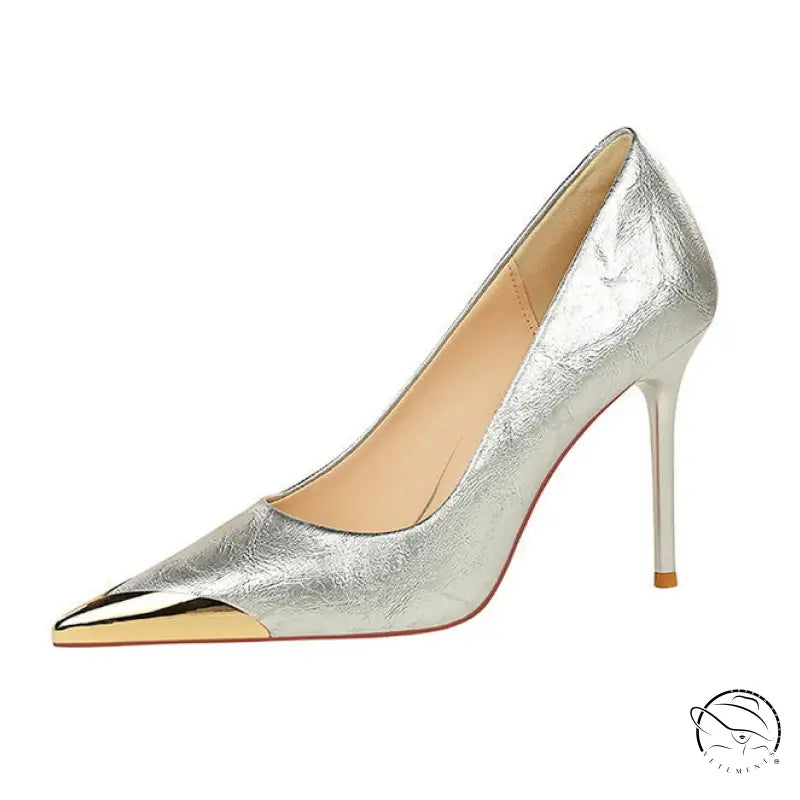 Silver metal pointed super high heel pump with gold toe cap and orange sole by Langry