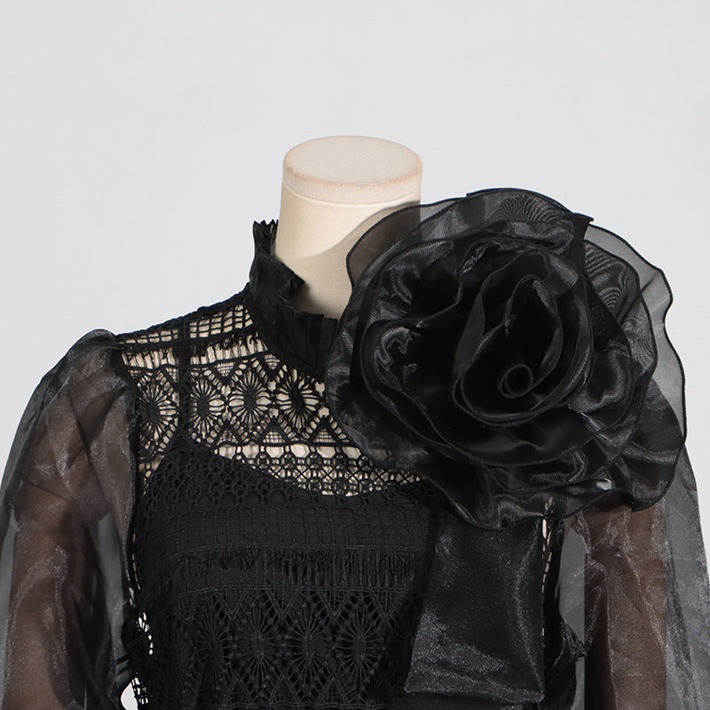 Black lace and organza dress with floral embellishment featuring elegant lantern sleeves