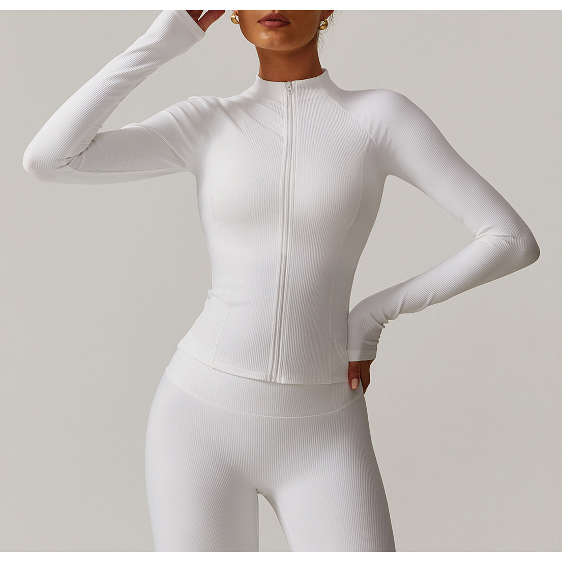 White fitted athletic jumpsuit with front zipper and long sleeves for casual running fashion