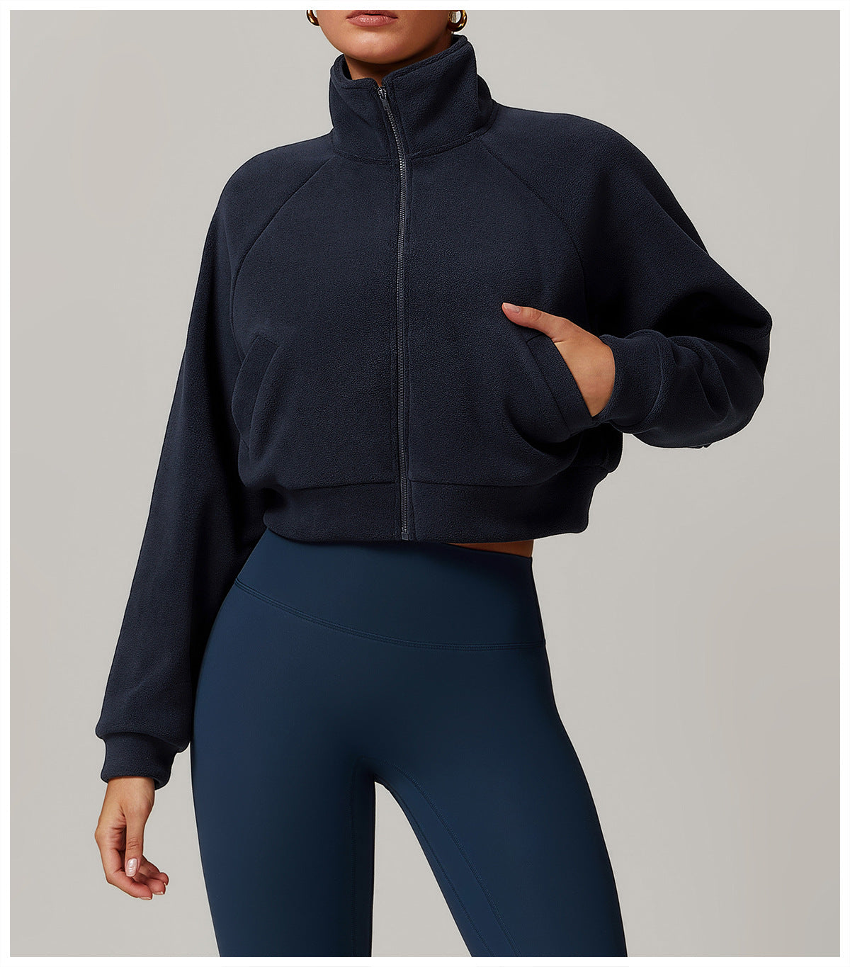 Cropped navy blue zip-up fleece jacket, ideal for langry fashion and fitness activities