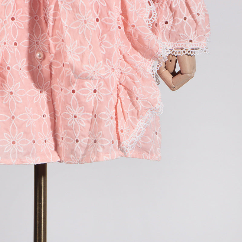 Pink eyelet dress with lace trim featuring stand collar and ruffled short sleeves