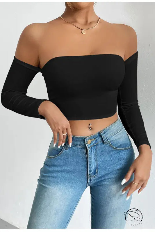 Black camisole waist trimming short sleeve crop top with light blue jeans
