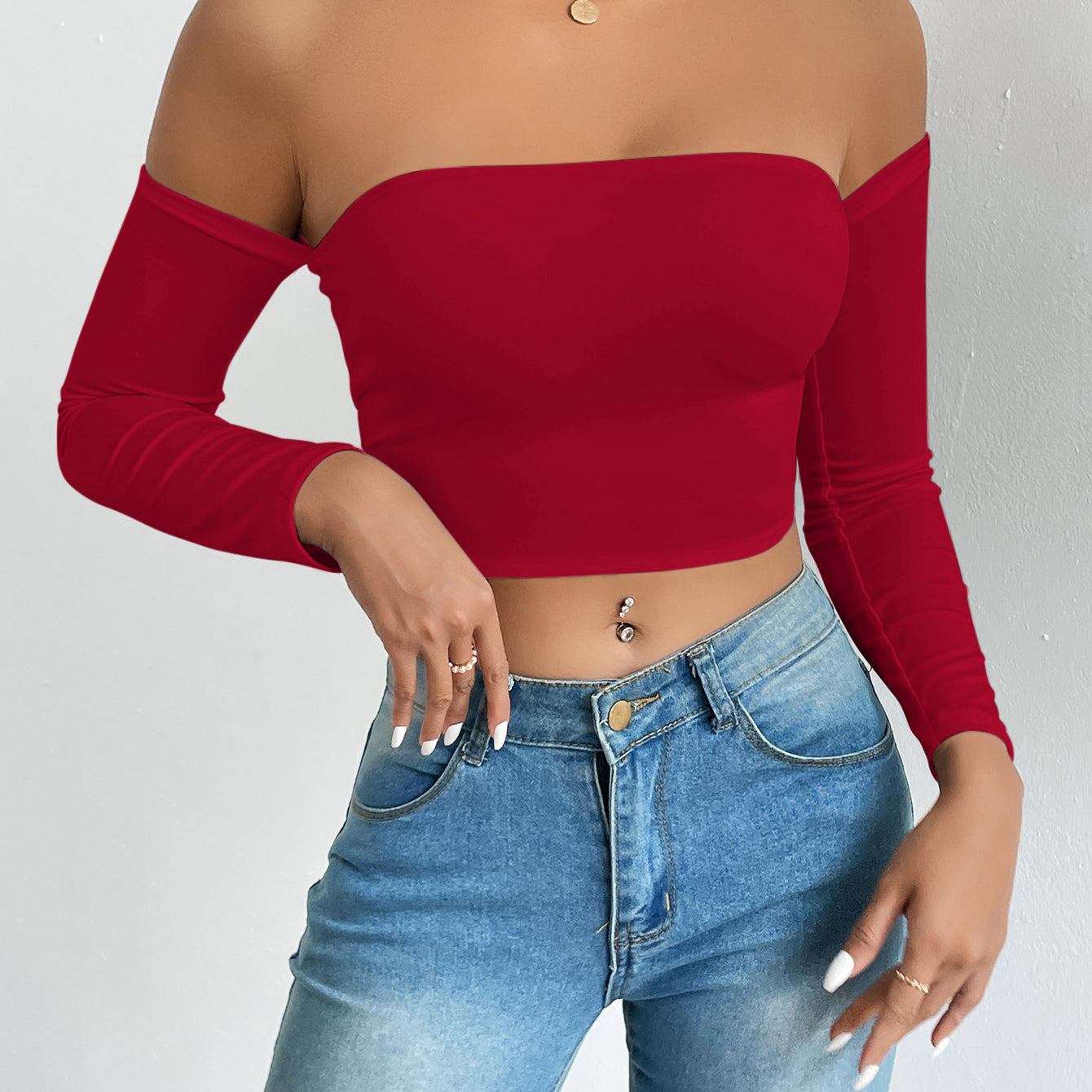 Red off-the-shoulder long-sleeve top showcasing trendy fashion and ملابس style