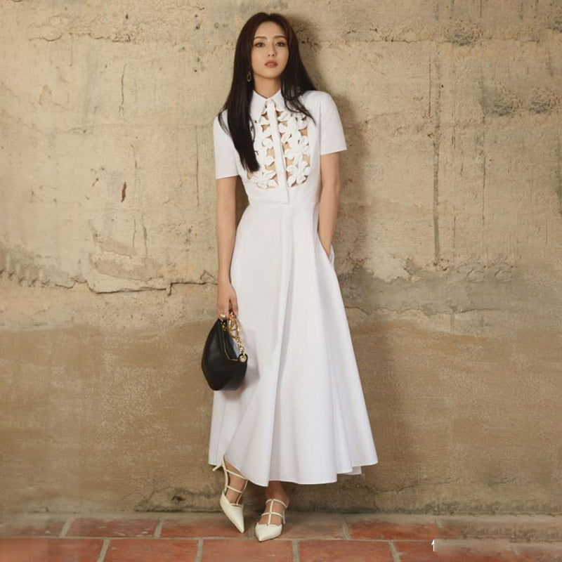 Elegant white midi dress showcasing sophisticated fashion and ملابس style