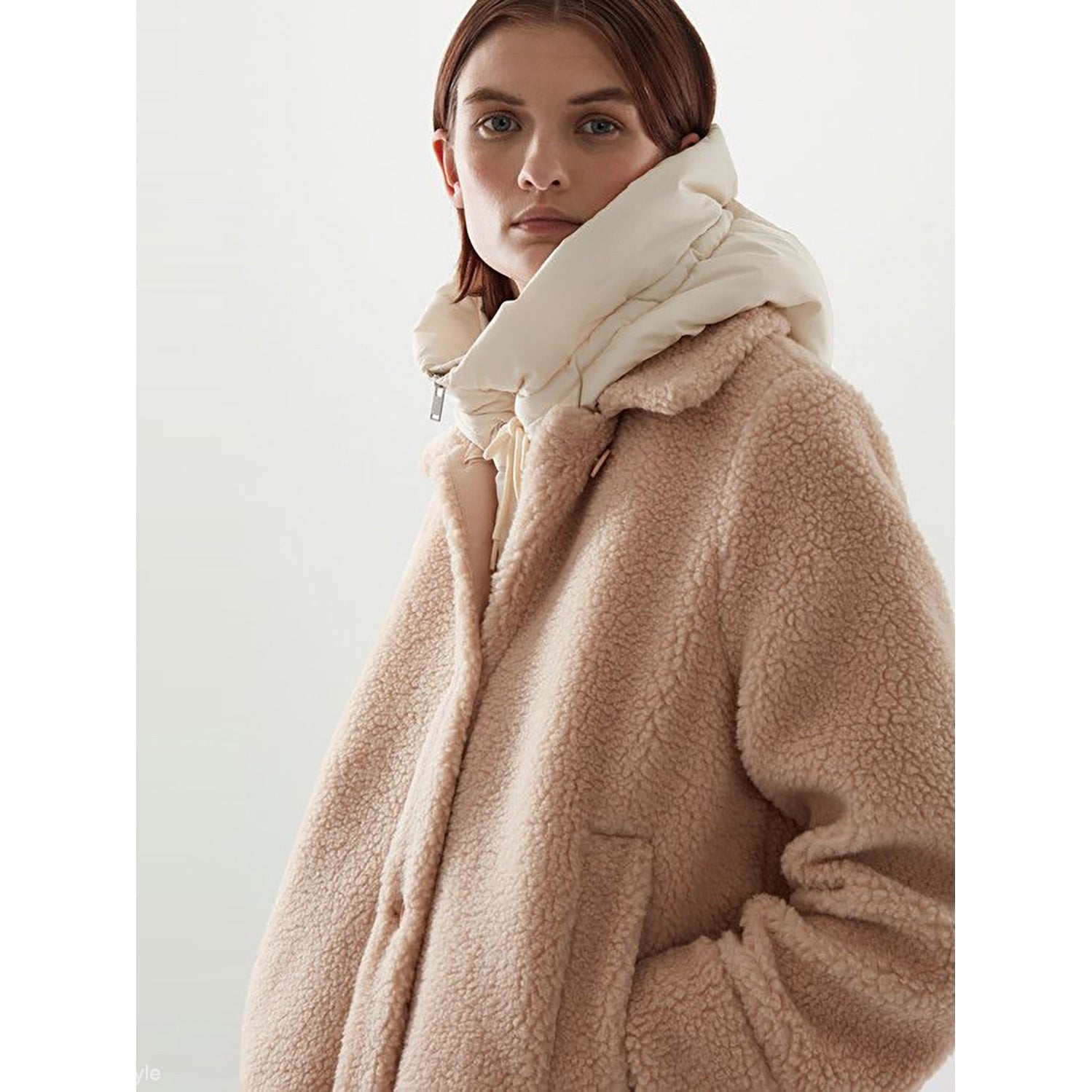 Woman’s beige teddy coat with white padded collar from Hooded Accessories collection