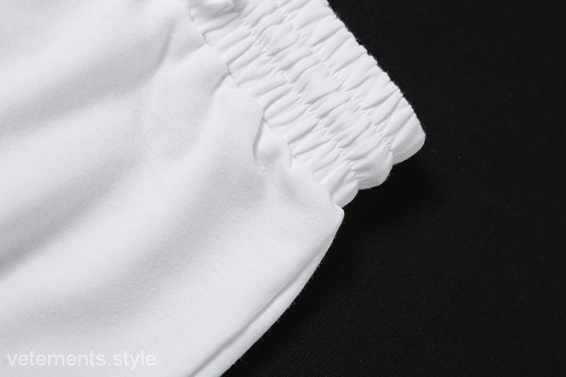 White elastic waistband on trendy tank two piece set with ankle-tied lace accents