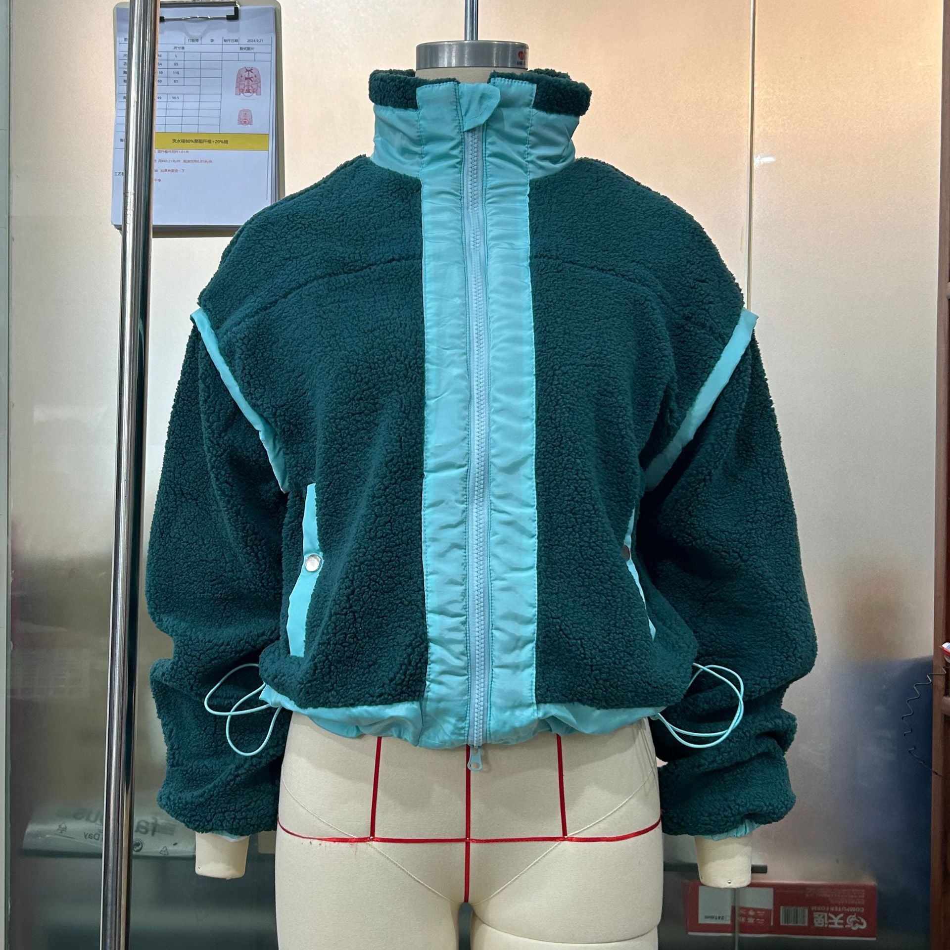 Green fleece jacket with light blue trim from Langry, ideal for outdoor fashion ملابس