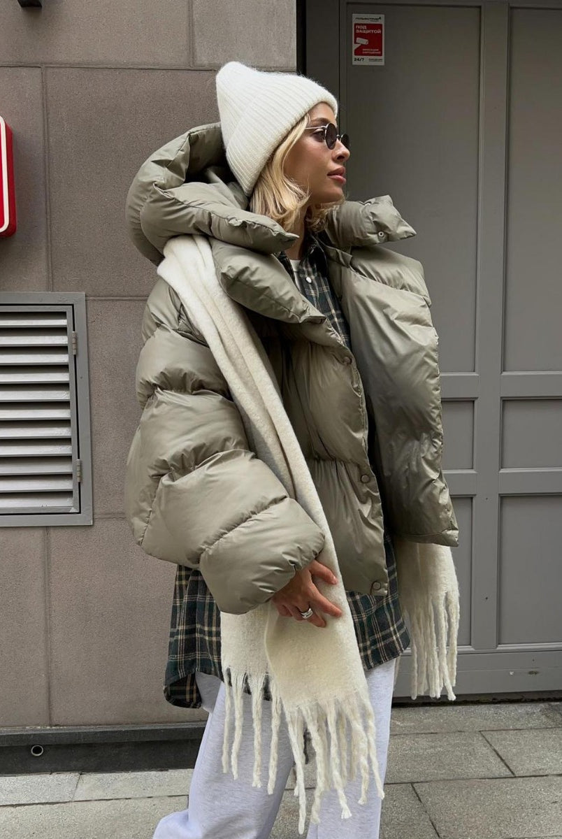 Woman in a puffy Cotton Padded Jacket, stylishly embracing langry fashion