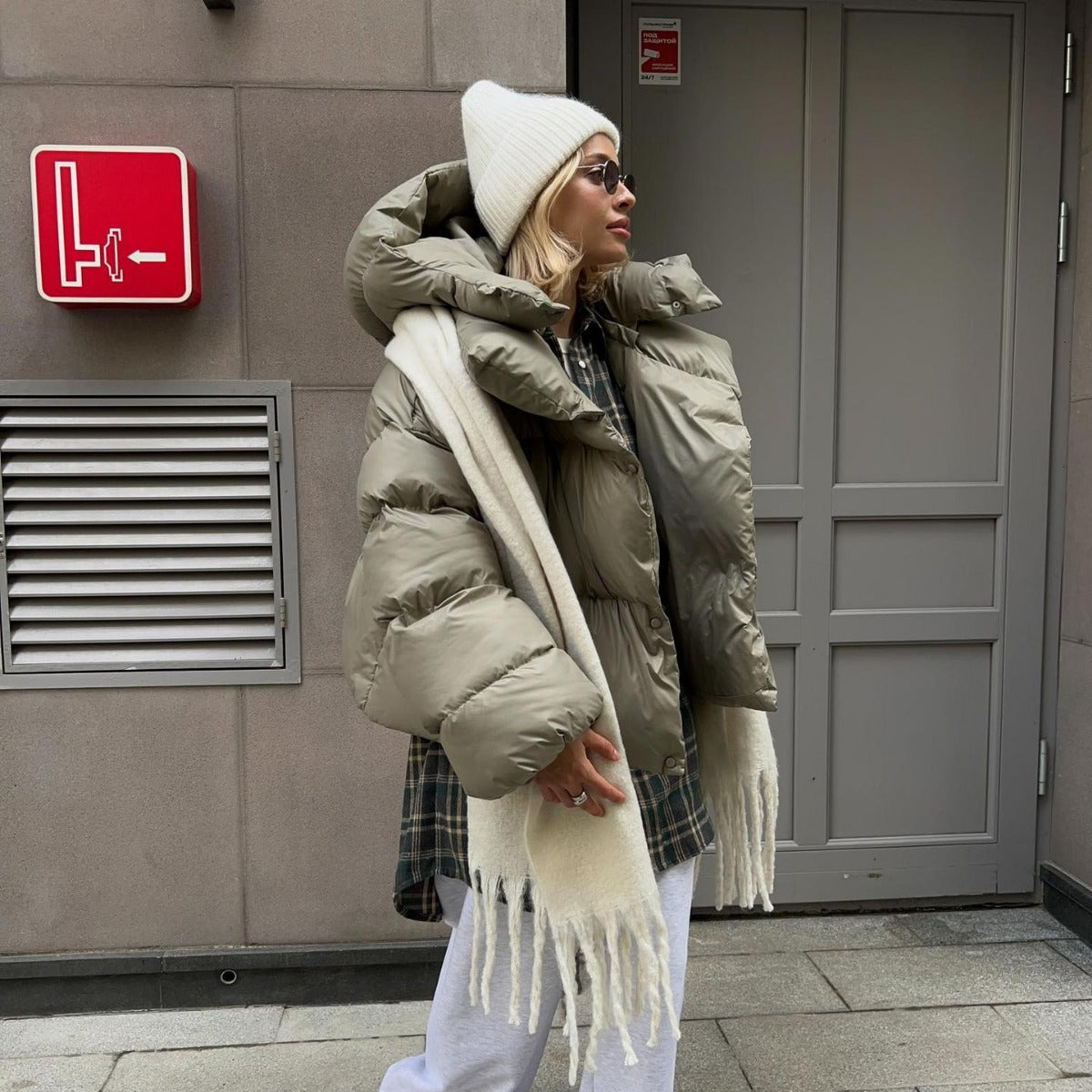 Woman in a puffy Cotton Padded Jacket, stylishly embracing langry fashion