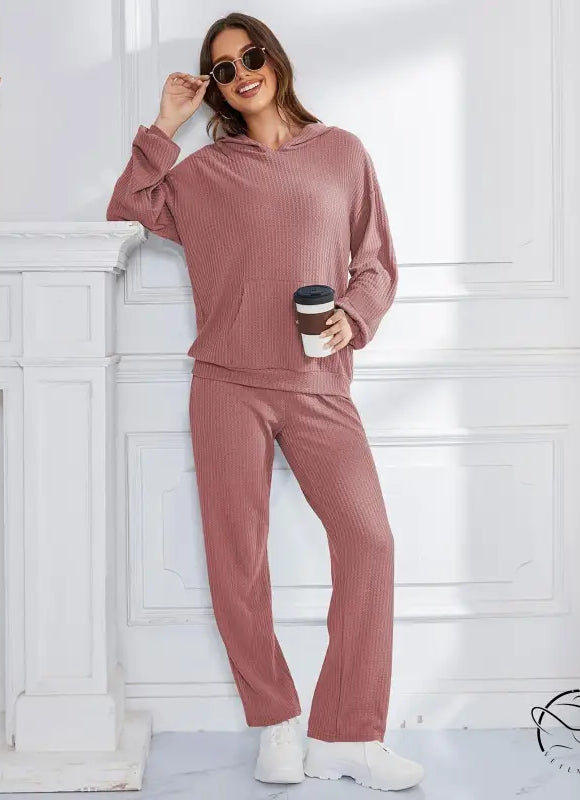 Woman in mauve ribbed hooded casual suit lounge set