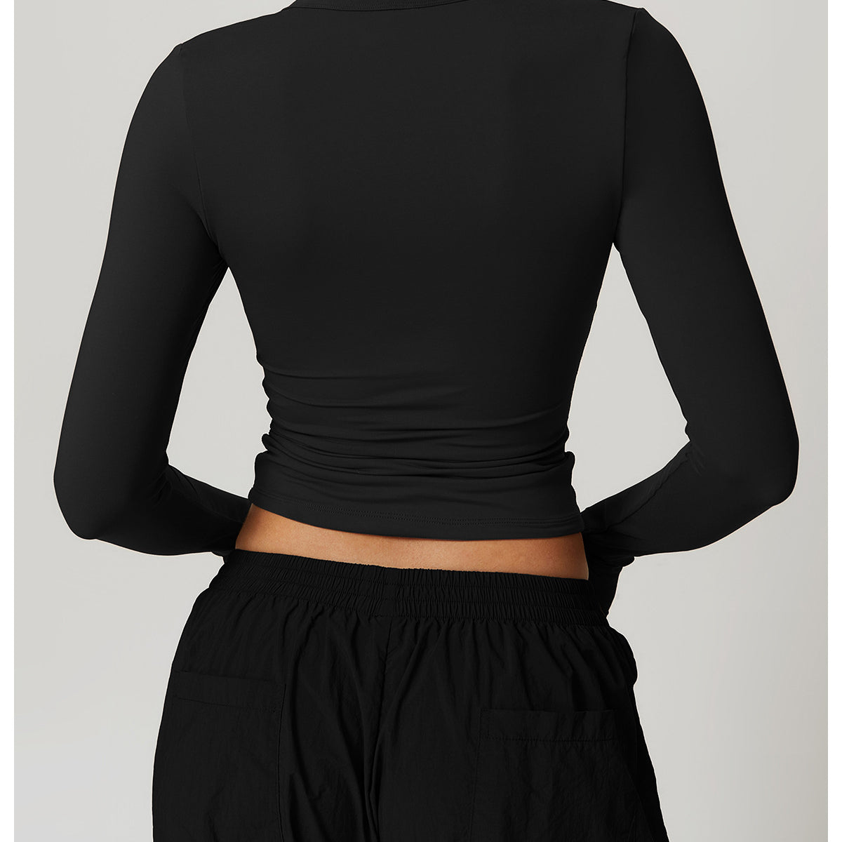 Black long-sleeved crop top and pants from Winter Quick Drying Brushed Tight Yoga T shirt collection showcasing stylish langry fashion and ملابس elegance