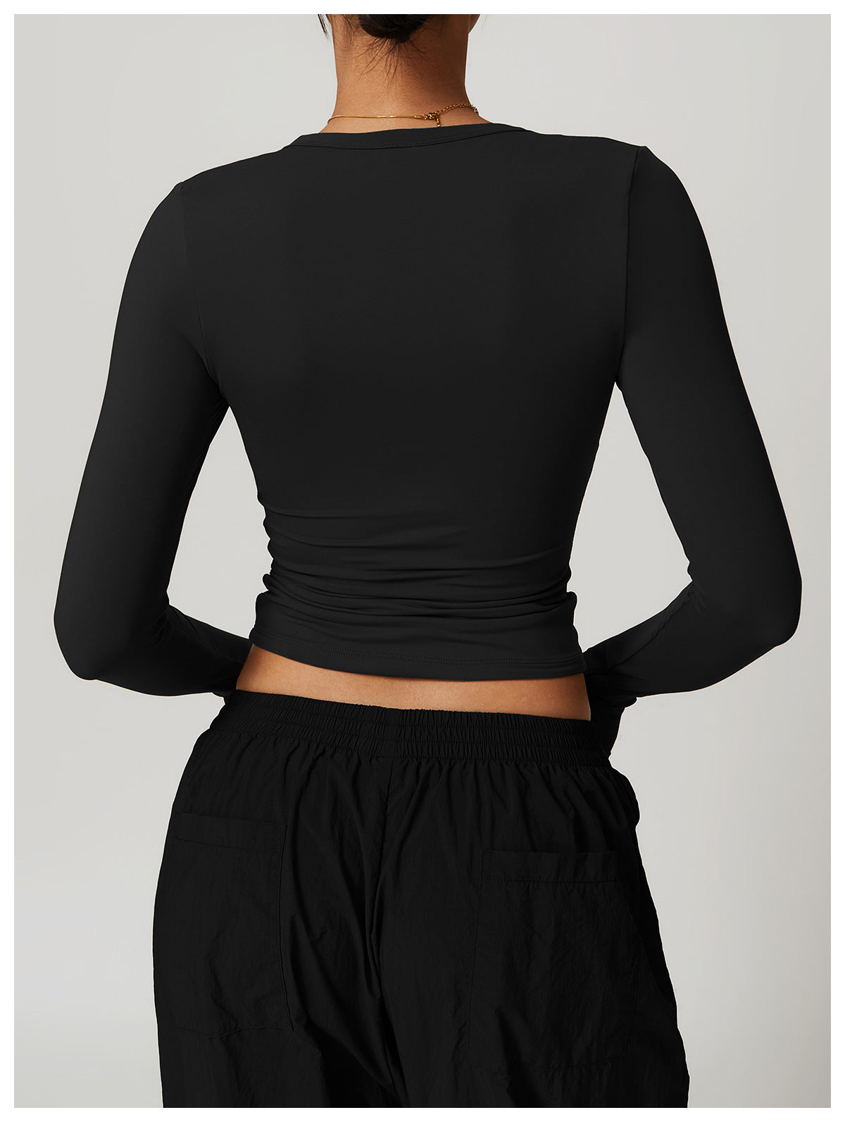 Black long-sleeved crop top and pants from Winter Quick Drying Brushed Tight Yoga T shirt collection showcasing stylish langry fashion and ملابس elegance