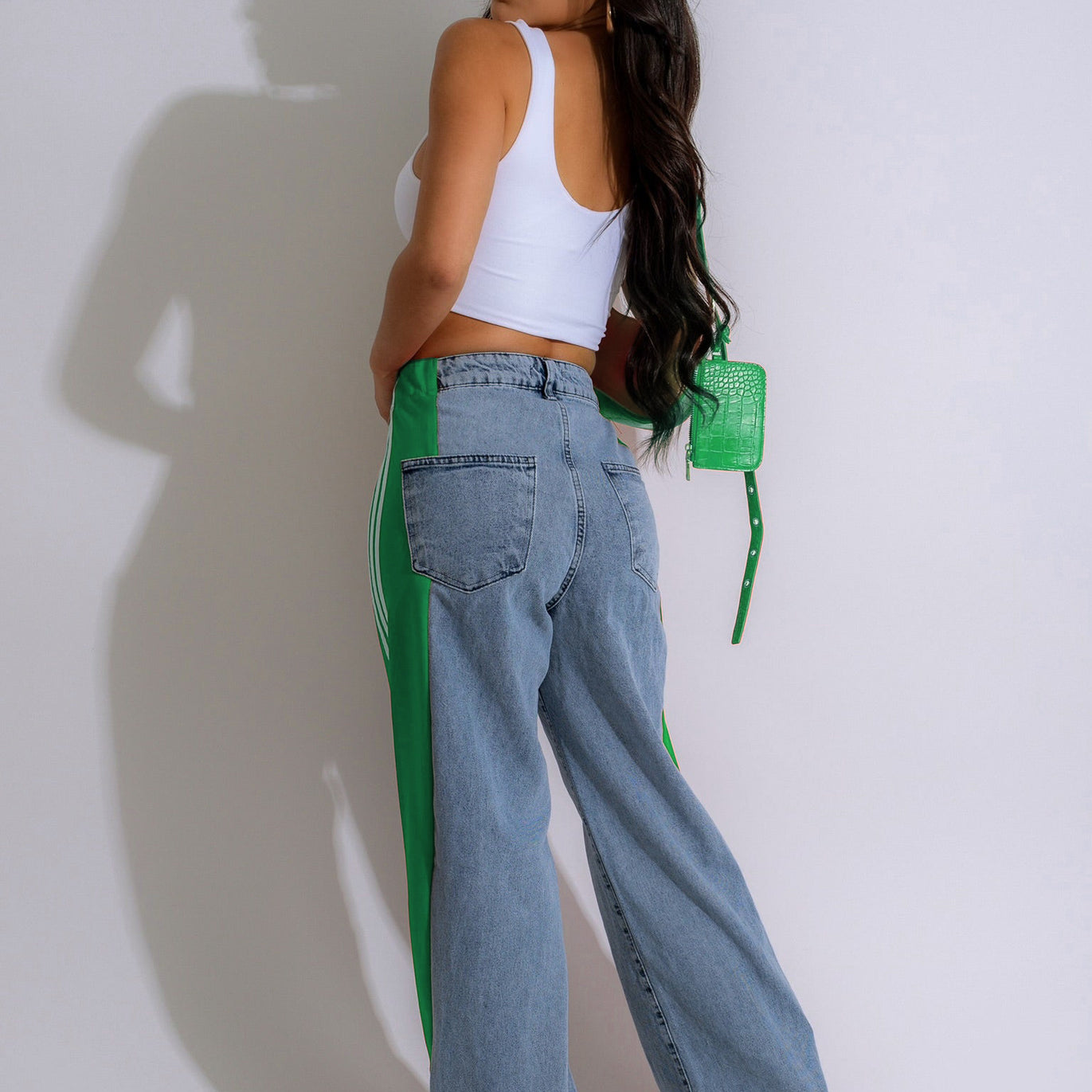 Wide-leg light blue denim jeans with neon green stripes for fashionable casual wear